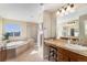 Lavish main bathroom showcasing a soaking tub, walk-in shower, and dual sink vanity at 26861 E Clifton Dr, Aurora, CO 80016