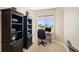 Small office with a computer desk, office chair, and window with a view of the neighborhood at 26861 E Clifton Dr, Aurora, CO 80016