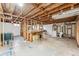 Unfinished basement featuring exposed beams, concrete floor, and potential for customization at 2024 Ford St, Golden, CO 80401