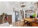 Open kitchen with stainless steel refrigerator, wood accents, and seamless transition to the dining space at 2024 Ford St, Golden, CO 80401