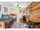 View of a combination living and work space featuring carpet and interesting wood paneled wall feature at 2024 Ford St, Golden, CO 80401