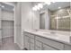 Modern bathroom with double vanity and a walk-in shower at 16783 W 94Th Way, Arvada, CO 80007