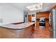 Bright kitchen features a marble breakfast bar, stainless steel refrigerator, and wooden cabinets at 370 S Parfet St, Lakewood, CO 80226