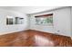 This living room features hardwood floors, a window, a mirror, and neutral walls at 370 S Parfet St, Lakewood, CO 80226