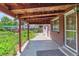 Back patio with a wooden ceiling, brick siding, and string lights, providing outdoor ambiance at 370 S Parfet St, Lakewood, CO 80226