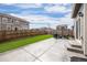 Spacious backyard with concrete patio, artificial turf, wood fence, and outdoor seating area at 14100 Shasta Daisy St, Parker, CO 80134