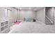 Finished basement space with carpeted floors, plenty of open area, and a stairway leading to the upper level at 14100 Shasta Daisy St, Parker, CO 80134