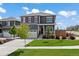 Charming two-story home featuring a well-manicured lawn, red shutters, and an attached two-car garage at 14100 Shasta Daisy St, Parker, CO 80134