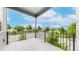 An open-air balcony provides a relaxing outdoor space with neighborhood views and black railings at 6799 Navajo St, Denver, CO 80221