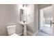 Charming half-bathroom featuring a pedestal sink and modern fixtures at 6799 Navajo St, Denver, CO 80221