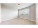 Bedroom features a large window providing natural light and neutral colored walls at 6799 Navajo St, Denver, CO 80221