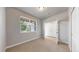 Bedroom with a large window allowing ample natural light and an entrance to another room at 6799 Navajo St, Denver, CO 80221