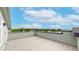 Spacious rooftop deck with scenic views of the surrounding area under a bright blue sky at 6799 Navajo St, Denver, CO 80221