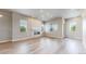 Bright living room with wood floors, modern fireplace, and lots of natural light at 6799 Navajo St, Denver, CO 80221