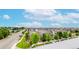 A scenic street view of a modern neighborhood showcases meticulously landscaped homes and tree-lined streets at 6799 Navajo St, Denver, CO 80221