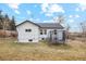 Backyard with partial fence and a trampoline on the lawn at 6420 W 6Th Ave, Lakewood, CO 80214