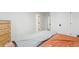 Bright bedroom with a wooden dresser and doorways leading to other areas of the home at 6420 W 6Th Ave, Lakewood, CO 80214