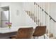 Bright breakfast nook with stair access and modern dining set perfect for easy meals and casual gatherings at 6420 W 6Th Ave, Lakewood, CO 80214