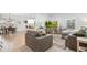 Bright, open living room showcases a modern aesthetic with neutral tones and comfortable seating arrangements at 6420 W 6Th Ave, Lakewood, CO 80214
