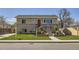Charming two-story home with manicured lawn and brick accents at 6488 E 63Rd Pl, Commerce City, CO 80022