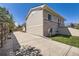 Exterior side elevation showing brick and siding with two car detached garage at 6488 E 63Rd Pl, Commerce City, CO 80022
