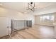 Stylish living area with modern chandelier and stairway access at 6488 E 63Rd Pl, Commerce City, CO 80022