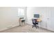 Bright bedroom with carpeted floors, a window, and office furniture at 1749 Havana St, Aurora, CO 80010