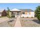 Charming home featuring a well-kept yard, stylish shutters, and a welcoming entrance, perfect for suburban living at 1749 Havana St, Aurora, CO 80010