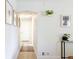 Bright hallway featuring modern decor and fresh paint, creating a welcoming path to the bedrooms at 1749 Havana St, Aurora, CO 80010