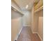 View of walk-in closet featuring built-in shelving and neutral carpeting at 4400 S Quebec St # C107, Denver, CO 80237