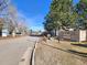 Welcome to Brandychase at Heather Park, with mature trees and well-kept grounds visible in this entrance view at 4400 S Quebec St # C107, Denver, CO 80237