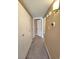 Hallway with large storage closet, wall decor, and view to a bedroom at 4400 S Quebec St # C107, Denver, CO 80237