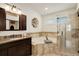 Elegant bathroom with soaking tub, glass shower, and granite vanity at 4605 S Yosemite St # 39, Denver, CO 80237