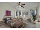 Stylized bedroom features a ceiling fan, neutral tones, and natural lighting at 4605 S Yosemite St # 39, Denver, CO 80237