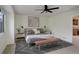 Stylized bedroom features a ceiling fan, accent rug, and natural lighting at 4605 S Yosemite St # 39, Denver, CO 80237