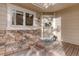 Charming front porch with a decorative wreath and stone accents at 4605 S Yosemite St # 39, Denver, CO 80237