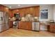 Modern kitchen featuring stainless steel appliances, custom cabinetry, and natural light at 4605 S Yosemite St # 39, Denver, CO 80237