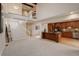 Bright living room flowing into kitchen features a loft and modern staircase at 4605 S Yosemite St # 39, Denver, CO 80237
