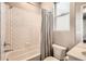 Bright bathroom with a tub and shower, featuring classic white subway tile and contemporary fixtures, providing a clean and functional space at 6058 Beeler Ct, Denver, CO 80238
