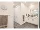 Bright bathroom with gray tiled floor, double vanity and toiletries at 6058 Beeler Ct, Denver, CO 80238