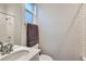 Modern bathroom with a shower-tub, window and vanity at 6058 Beeler Ct, Denver, CO 80238