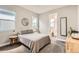 Bedroom with gray walls, carpet, queen bed and natural light at 6058 Beeler Ct, Denver, CO 80238