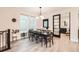Elegant dining room with ample natural light, stylish decor, and a seamless connection to office at 6058 Beeler Ct, Denver, CO 80238