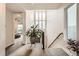 Stairwell with large plant and natural light at 6058 Beeler Ct, Denver, CO 80238