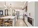 Gourmet kitchen with sleek white cabinetry, stainless steel appliances, and a large island at 6058 Beeler Ct, Denver, CO 80238
