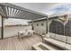 Inviting rooftop deck featuring a pergola, modern furniture, and a cozy fire pit at 6058 Beeler Ct, Denver, CO 80238