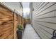 Landscaped side yard featuring a walkway with a wooden fence at 6058 Beeler Ct, Denver, CO 80238