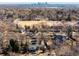 An aerial view of the neighborhood with views of the city skyline and a park or recreation area at 2360 Estes St, Lakewood, CO 80215