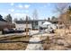 Backyard patio featuring lounge furniture, barbecue, a shaded dining table and grassy area at 2360 Estes St, Lakewood, CO 80215