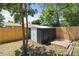Backyard metal shed with a wood privacy fence and brick flooring at 2616 W 134Th Cir, Broomfield, CO 80020